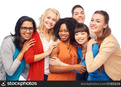 diversity, race, ethnicity and people concept - international group of happy smiling different women over white hugging. international group of happy women hugging