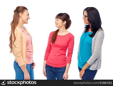 diversity, race, ethnicity and people concept - international group of happy smiling different women over white talking. international group of happy smiling women talking