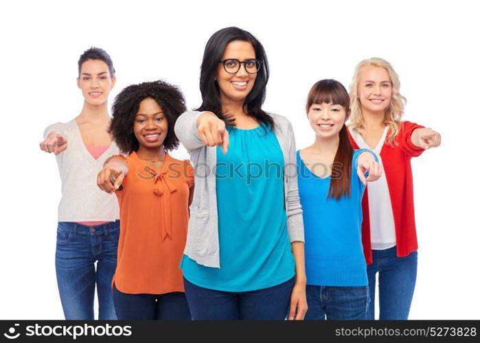 diversity, race, ethnicity and people concept - international group of happy smiling different women over white pointing finger at you. international group of happy smiling women