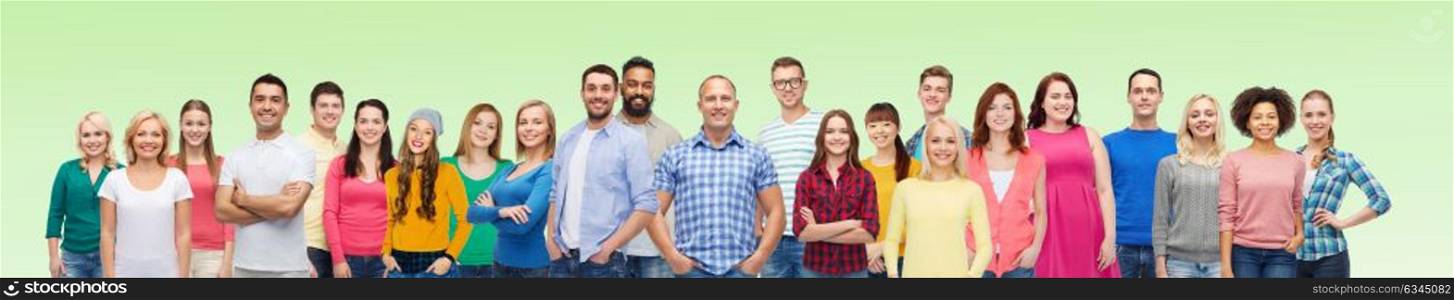 diversity, race, ethnicity and people concept - international group of happy smiling men and women over green background. international group of happy smiling people