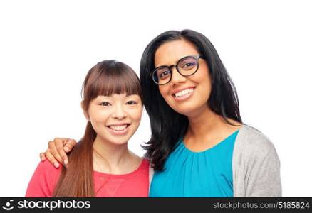 diversity, race, ethnicity and people concept - two happy smiling women or international friends. two happy smiling women or international friends