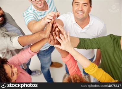 diversity, race, ethnicity, gesture and people concept - international group of happy smiling men and women making high five