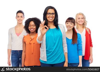 diversity, race, ethnicity, gesture and people concept - international group of happy smiling different women over white showing ok hand sign. international group of happy women showing ok
