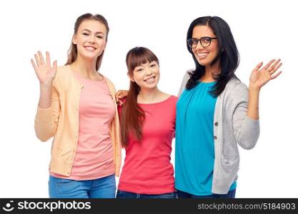 diversity, race, ethnicity, gesture and people concept - international group of happy smiling different women over white waving hands. international group of happy women waving hands