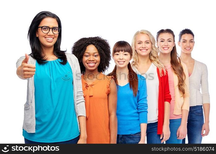 diversity, race, ethnicity, gesture and people concept - international group of happy smiling different women over white showing thumbs up. international group of women showing thumbs up