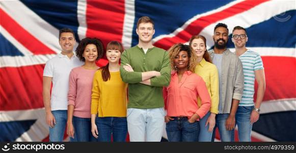 diversity, race, ethnicity, immigration and people concept - international group of happy smiling men and women over english flag background. group of international people over english flag