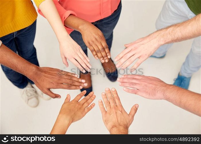 diversity, race, ethnicity, international and people concept - group of hands