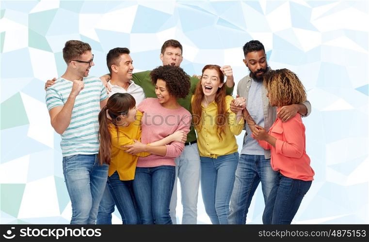 diversity, race, ethnicity, success and people concept - international group of happy smiling men and women celebrating victory over blue low poly background