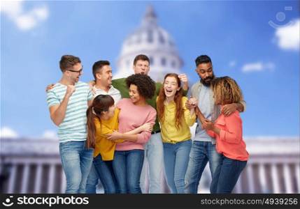 diversity, race, ethnicity, success and people concept - international group of happy smiling men and women celebrating victory over united states capitol background. international group of happy smiling people