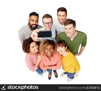diversity, race, ethnicity, technology and people concept - international group of happy smiling men and women taking selfie by smartphone over white
