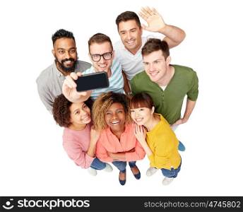 diversity, race, ethnicity, technology and people concept - international group of happy smiling men and women taking selfie by smartphone over white. group of people taking selfie by smartphone
