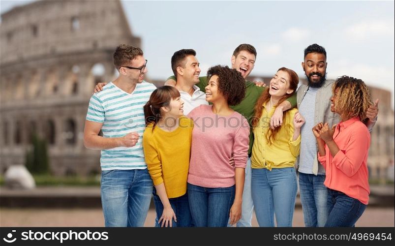 diversity, travel, tourism and people concept - international group of happy men and women laughing over coliseum background. international group of happy people over coliseum