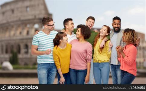 diversity, travel, tourism and people concept - international group of happy men and women laughing over coliseum background. international group of happy people over coliseum