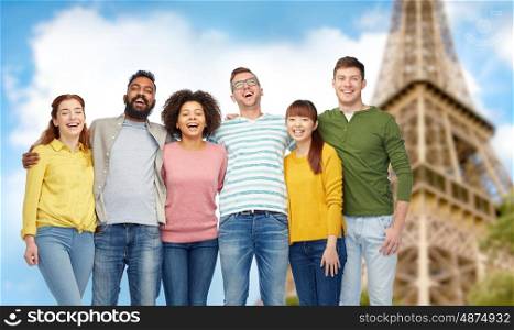 diversity, travel, tourism and people concept - international group of happy smiling men and women over eiffel tower background
