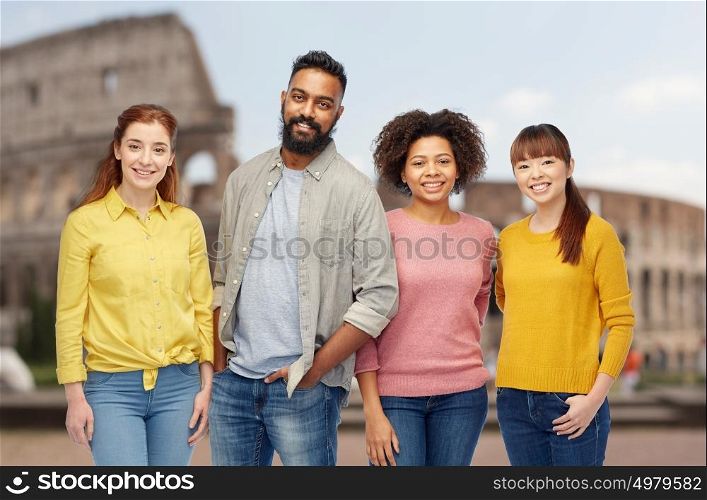 diversity, travel, tourism and people concept - international group of happy smiling men and women over coliseum background. international group of happy smiling people