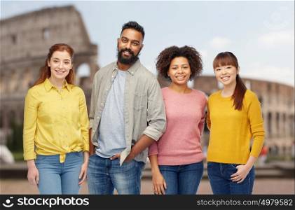 diversity, travel, tourism and people concept - international group of happy smiling men and women over coliseum background. international group of happy smiling people