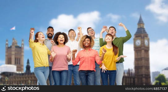 diversity, travel, tourism, success and people concept - international group of happy smiling men and women celebrating victory over london city background