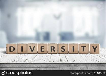 Diversity word sign on a wooden desk in a bright blue room