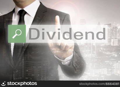 Dividend browser with businessman and city concept.. Dividend browser with businessman and city concept
