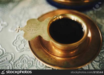 Divine Liturgy. Wine, the blood of God in the cup before the wedding ceremony in the church.. Wine, the blood of God in the cup before the wedding ceremony in the church. Divine Liturgy