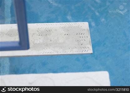 Diving board near a swimming pool