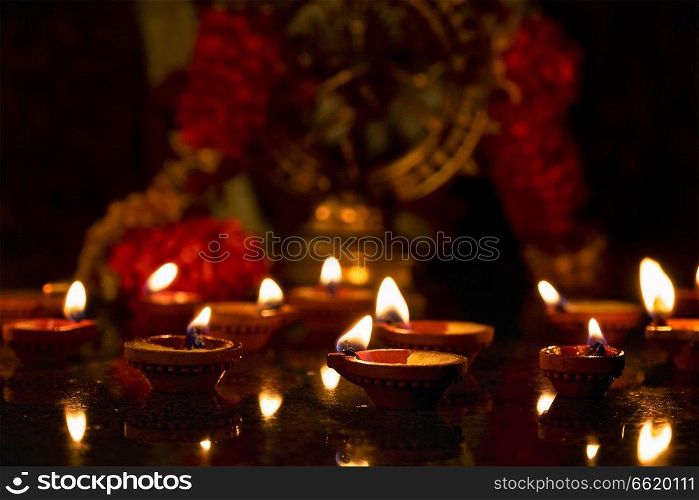 Diwali lights oil candles with Shiva Nataraja in the background for Maha Shivaratri,  India. Diwali lights, India
