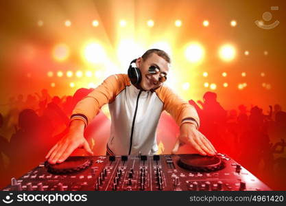 dj and mixer. DJ with a mixer equipment to control sound and play music