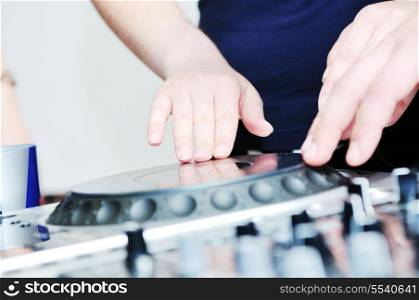 dj equipment gramophone and mixete with dj hand on party event