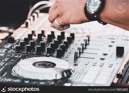 Dj mixing at beach party in summer