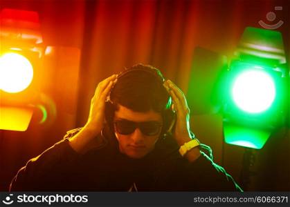 DJ mixing music at disco