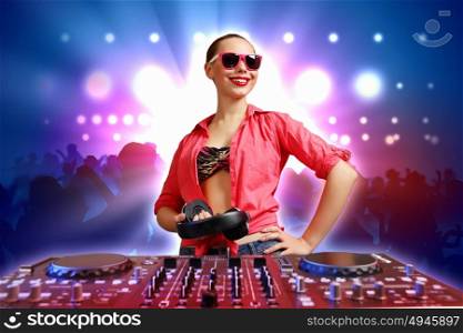 DJ with a mixer equipment to control sound and play music. dj and mixer