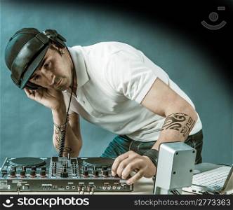 DJ with mixer is working , foto with copyspace