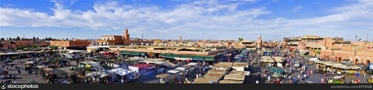 Djemaa el Fna market in Marrakesh, Morocco, with Koutubia Mosque at the back