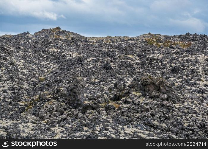 Djupalonssandur black volcanic lava rocks view from spectacular Djupalonssandur beach, Snaefellsnes peninsula, Snaefellsjokull National Park, West Iceland.