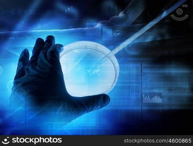 DNA molecule. Close up image of human hand holding test tube. Science concept