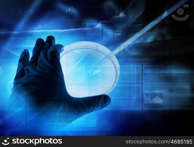 DNA molecule. Close up image of human hand holding test tube. Science concept