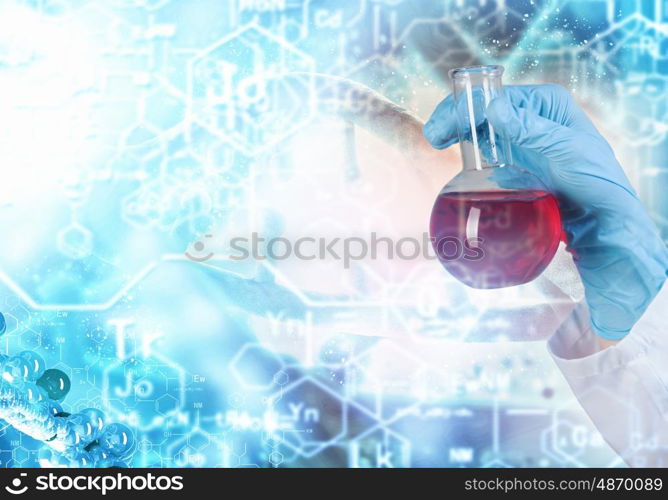 DNA molecule. Close up image of human hand holding test tube. Science concept