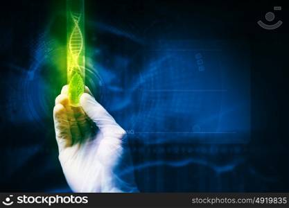 DNA molecule. Close up image of human hand holding test tube. Science concept