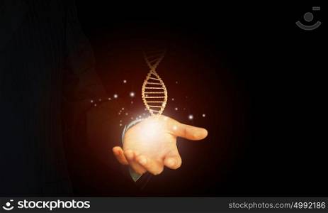 Dna molecule. Close up of man holding DNA molecule in palm