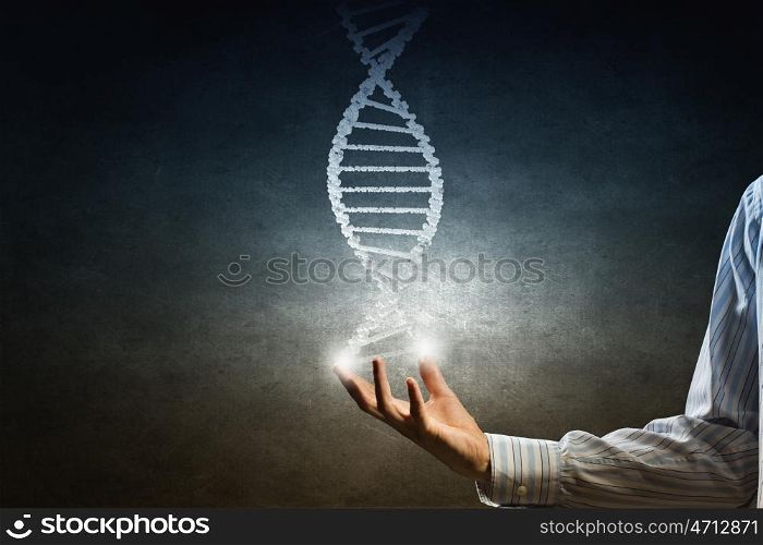 Dna molecule concept. Hand of businessman holding dna molecule concept