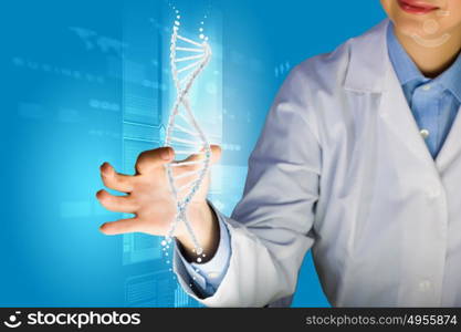 DNA molecule. Woman scientist touching DNA molecule image at media screen