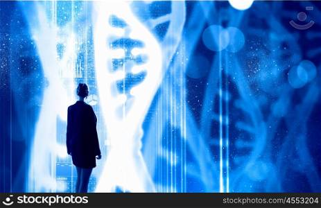 Dna research. Businesswoman standing with back and virtual panel with dna spiral
