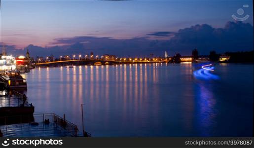 Dnipro quay on sunset background and wark colors