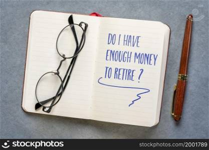 Do I have enough to retire? Handwriting in a notebook or journal. Finance and retirement planning concept.