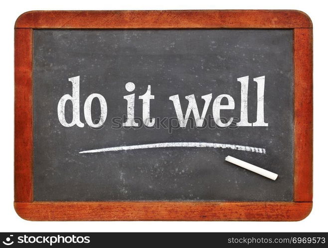 Do it well motivational note - white chalk text on a vintage slate blackboard. blackboard