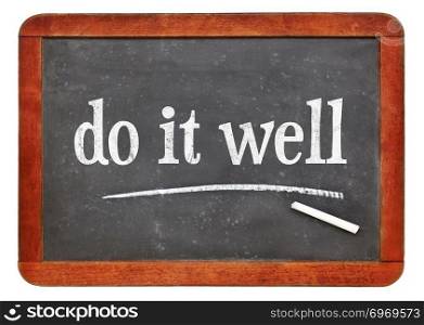 Do it well motivational note - white chalk text on a vintage slate blackboard. blackboard