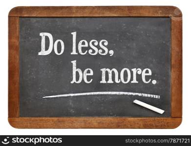 Do lees, be more - motivational advice on a vintage slate blackboard