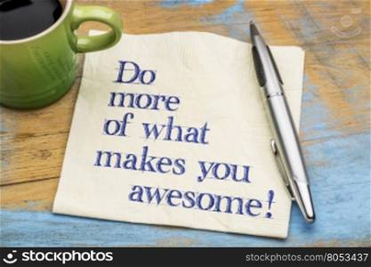 Do more of what makes you awesome - motivational handwriting on a napkin with a cup of espresso coffee