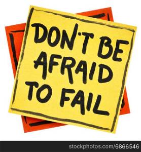 Do not be afraid to fail reminder or advice - handwriting in black ink on an isolated sticky note