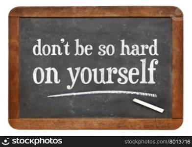 do not be so hard on yourself - white chalk text on a vintage slate blackboard